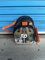 Full view of Loungefly Halloween mini backpack front, orange strap visible