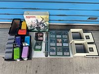 Full lot showing binder, deck boxes, storage boxes, and product box