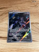 Front of sealed holographic Mewtwo card showing artwork, HP, and attacks