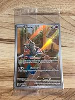 Front view of sealed Mimikyu promo card