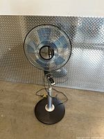 Full view Rowenta pedestal fan, grill, stand, cord