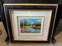 Front view of framed landscape print