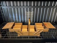 Basket fully extended showing four compartments and handle