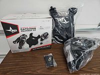 Box and three sealed gear components displayed