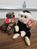 Cheeks and Mooch Beanie Babies on tabletop showing overall appearance