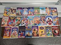 Front covers of all 26 VHS tapes laid out