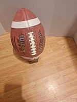 Wilson 2011 Grey Cup football upright showing laces and branding