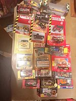 Overview of all packaged die-cast vehicles spread on table