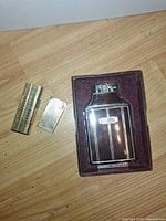 Ronson Mastercase lighter in case, two gold-tone lighters