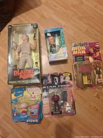 Group shot of all five boxed action figures