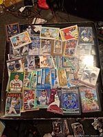 Overview of approximately 40 trading cards with relic, autograph, rookie and parallel varieties
