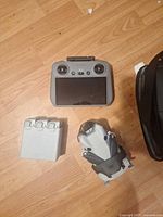 DJI Mini 3 drone, DJI RC controller, battery charging hub