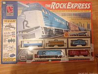 Front of boxed Life-Like The Rock Express HO scale train set showing contents and graphics