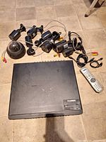 Top view of DVR, cameras, and remote