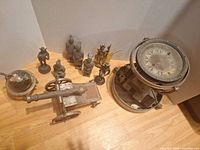 Overview showing compass, cannon, globe, and figurines