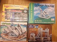 All five boxed puzzle and kit items shown together