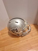 Left front view of full-size Raiders helmet