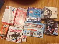 All nine game boxes arranged on wooden floor