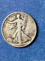Obverse of 1945 Walking Liberty half dollar coin, showing date and Liberty design
