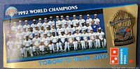 Front of display card with team photo, Blue Jays logo, Domino’s Pizza logo and pin attached