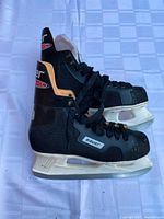 Bauer composite hockey skates with white holders