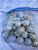 Bag filled with mixed used golf balls