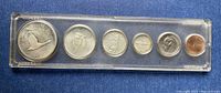 Obverse of six 1967 Centennial coins in sealed plastic case