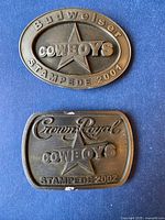 Front view showing both belt buckles and embossed details