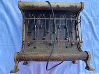 Front view showing heating elements, ceramic insulators, overall shape and condition