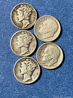 Obverse of five silver dimes showing dates 1942, 1943, 1944, 1947, 1964
