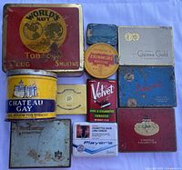Group shot of ten mixed vintage tobacco tins