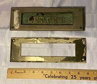 Exterior and interior brass mail slot plates with ruler for scale