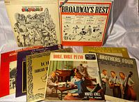 All eight record albums arranged to display cover art