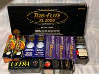 All boxed golf balls laid out showing brands and quantities