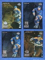 Front view of all four trading cards showing players Marty McSorley, Brian Leetch (2), Paul Coffey