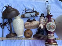 Group shot of all eight lamp bases and parts