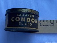 Side view showing Gallaher’s Condor Sliced label and ruler for scale