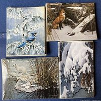 Front view of four sealed packs showing each wildlife design