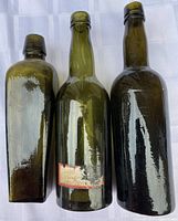 All three antique bottles front view