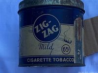 Side view showing Zig-Zag Mild label and 65¢ price