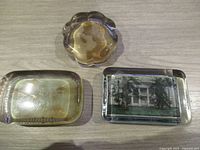 All three paperweights on table