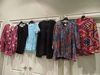 All six tops hanging for full view