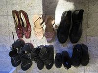 All seven pairs of shoes laid out