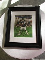 Full view of framed autographed photo