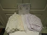 Group shot showing all lace pieces and boxed pillowcases on table