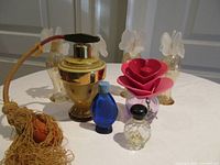 Group shot of all seven perfume bottles on table