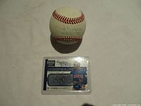 Baseball and signed card together