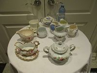 Group view of all porcelain pieces on table