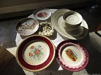 Overhead view showing full assortment of plates, bowls, platters and trinket dish