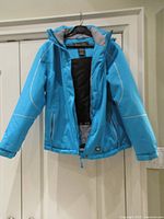 Front view of blue hooded winter coat hanging on hanger